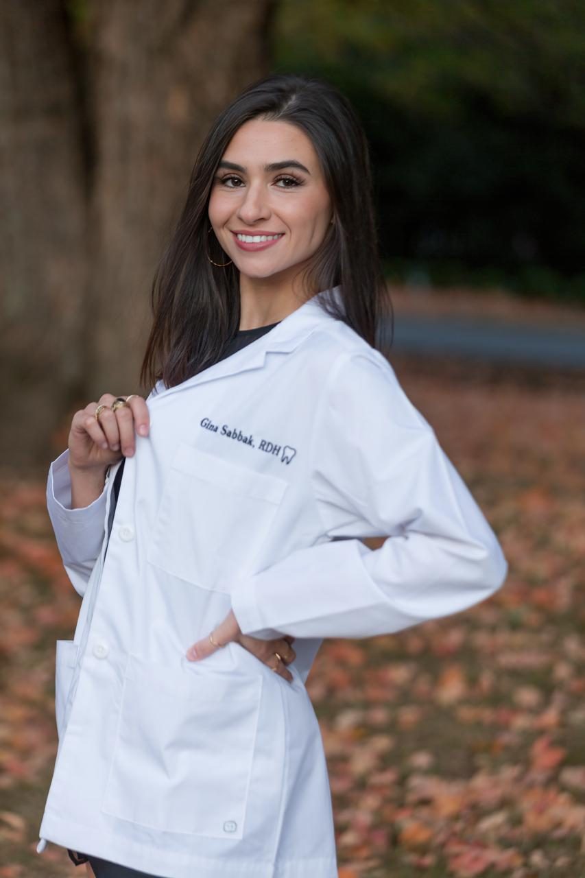 Gina Sabbak, RDH — myofunctional therapist in Louisville, KY — photographed outdoors in fall light.